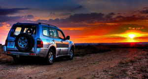 Jeep driving into the sunset